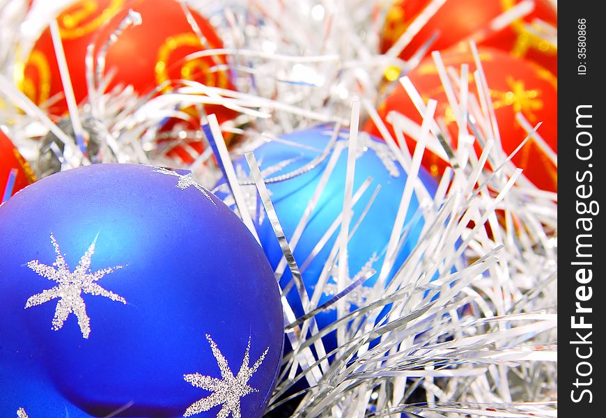 Blue and red decoration balls with silver tinsel