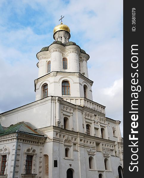 Collegium building with church in Chernigiv. Ukraine. Sky with clouds.