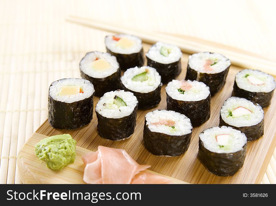 Freshly prepared maki rolls (with wasabi and ginger)