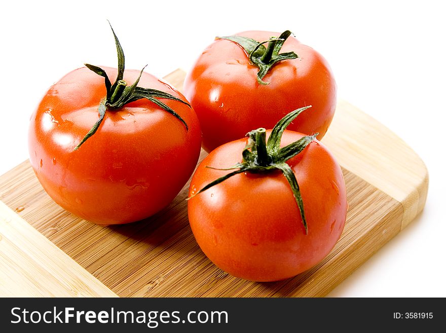 Fresh tomatoes isolated on white background