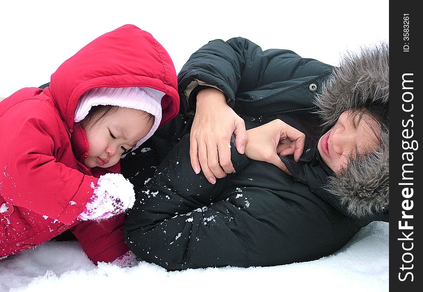 Mother and Daughter playing in the snow. Mother and Daughter playing in the snow