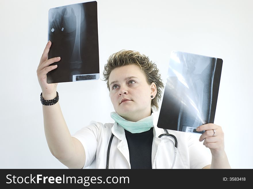 Female doctor checking x-ray results