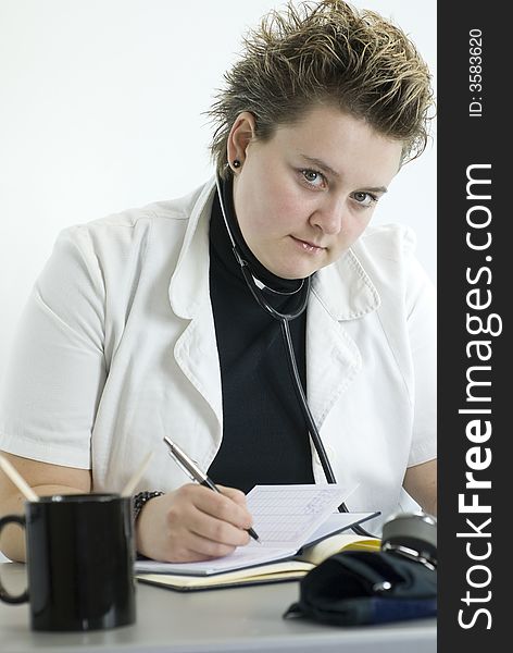 Female doctor writing down portrait