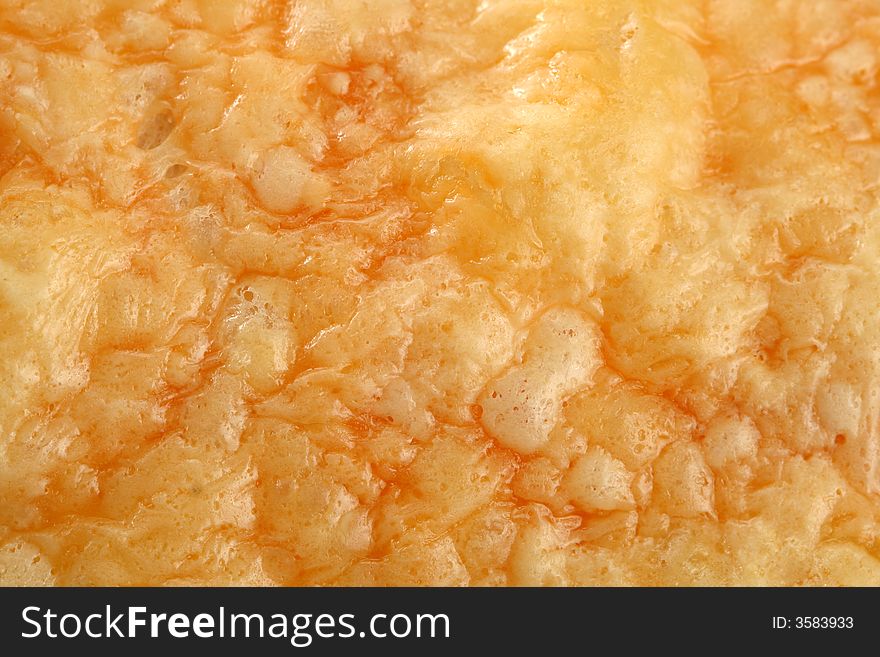 Fresh bread with a cheese crust, background