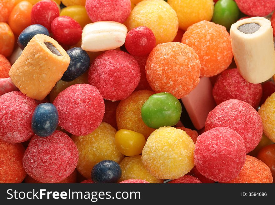 Horizontal background made of multi-coloured sweets, (look similar images in my portfolio). Horizontal background made of multi-coloured sweets, (look similar images in my portfolio)