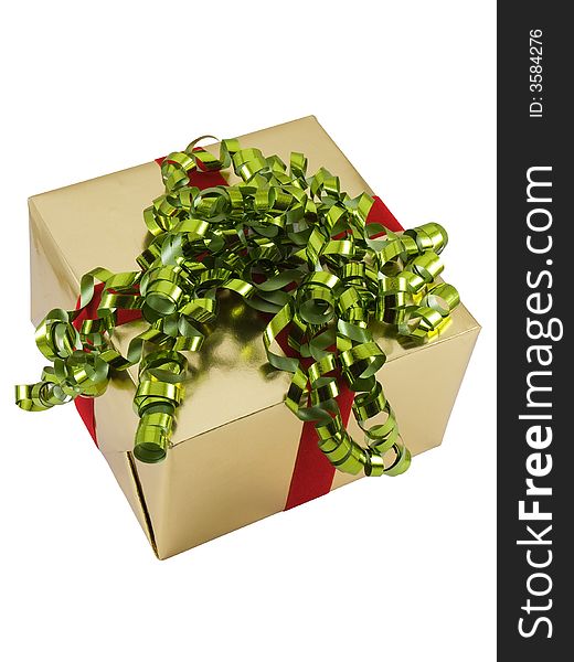 Christmas present wrapped with curly ribbon on top, isolated on white