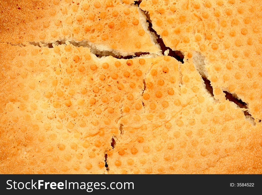 The cracked crust of bread, background