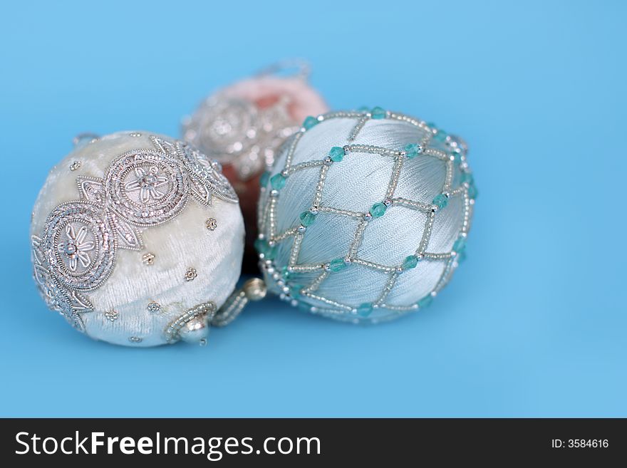 Ornate christmas ornaments on a blue background. Ornate christmas ornaments on a blue background