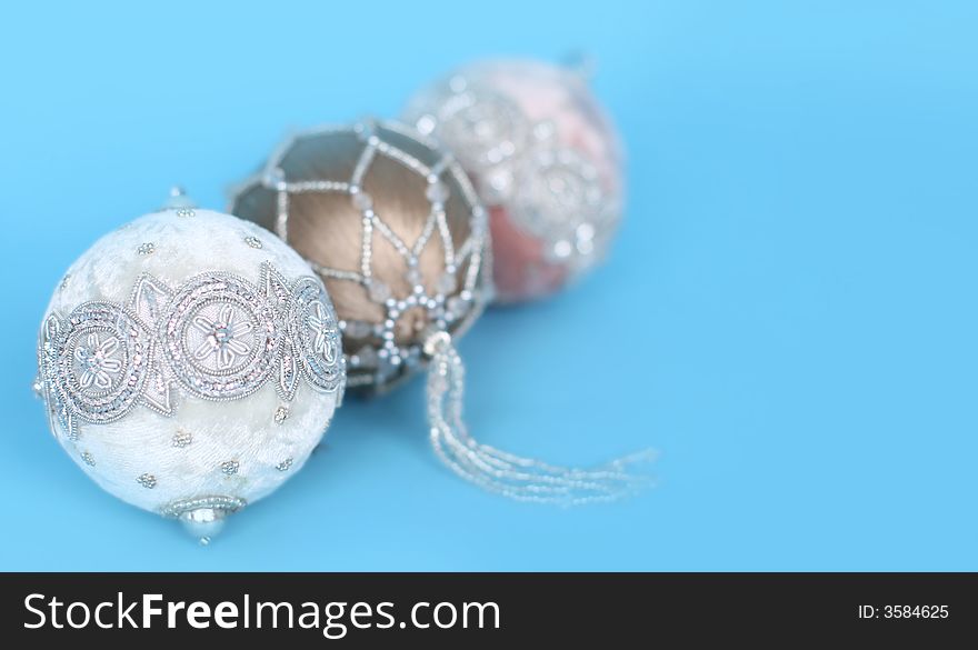 Ornate christmas ornaments on a blue background. Ornate christmas ornaments on a blue background