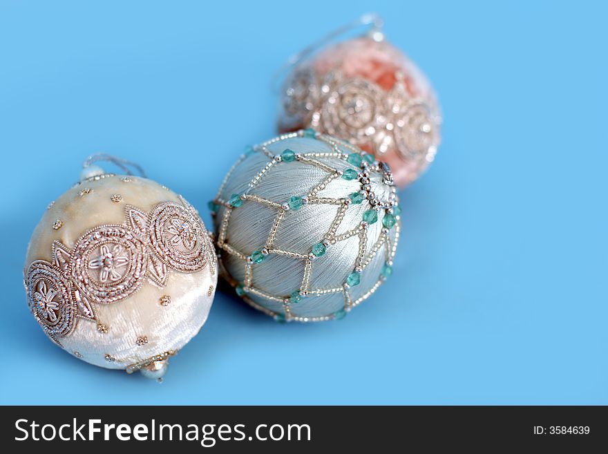 Ornate christmas ornaments on a blue background. Ornate christmas ornaments on a blue background