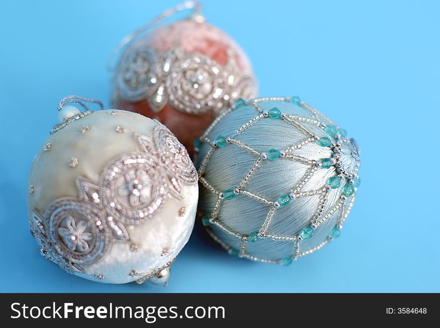 Ornate christmas ornaments on a blue background. Ornate christmas ornaments on a blue background