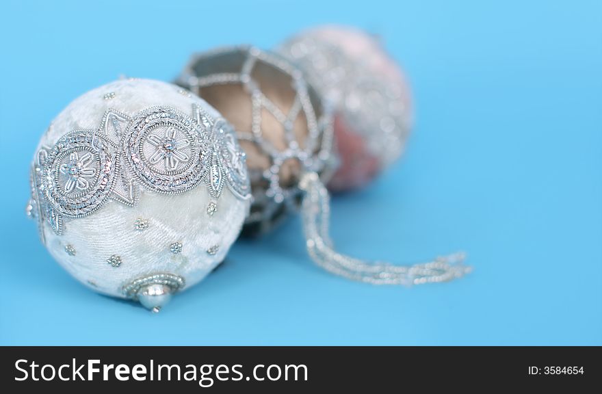 Ornate christmas ornaments on a blue background. Ornate christmas ornaments on a blue background