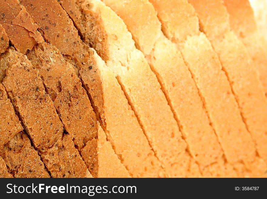 Sliced multicoloured bread, food background