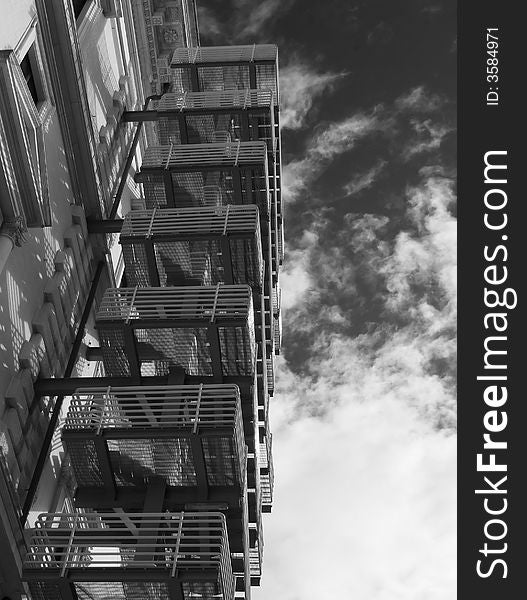 View of an emergency staircase against the blue sky