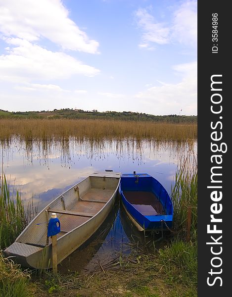 Old boats parked on a lakeside. Old boats parked on a lakeside