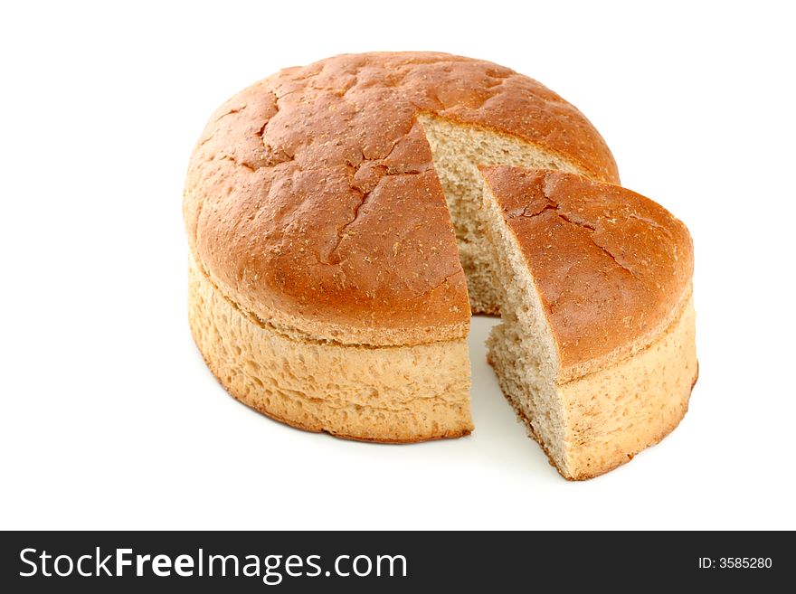 Slised loaf of fresh bread, isolated on white