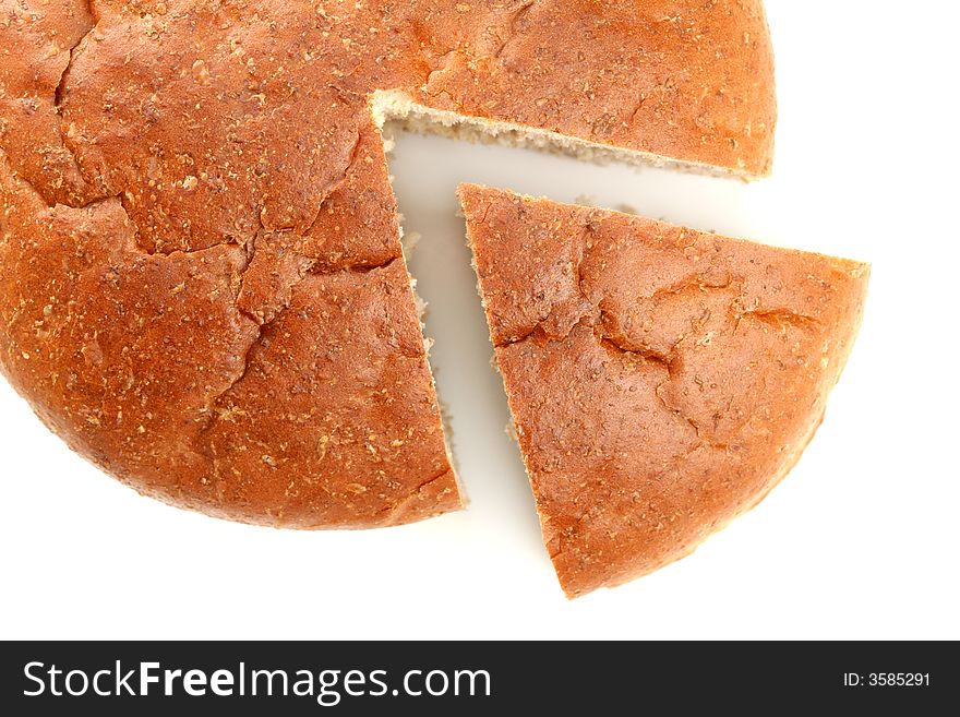 Slised loaf of fresh bread, isolated on white