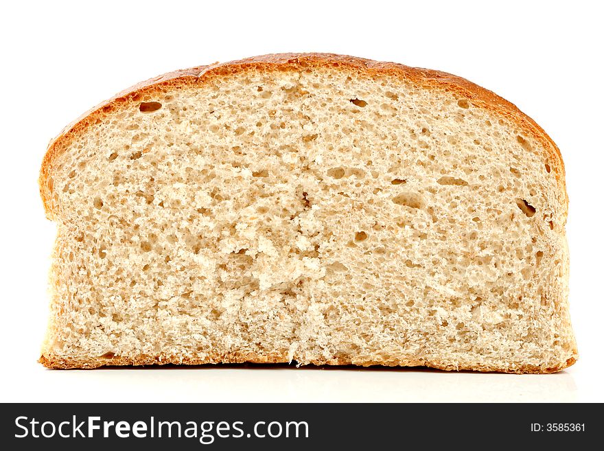 Slised loaf of fresh bread, isolated on white