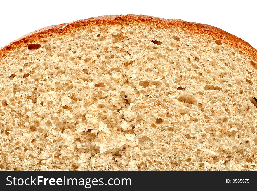 Slised loaf of fresh bread, isolated on white