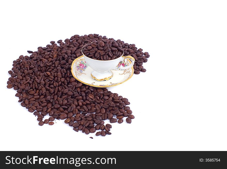 Coffee cup with spilled beans