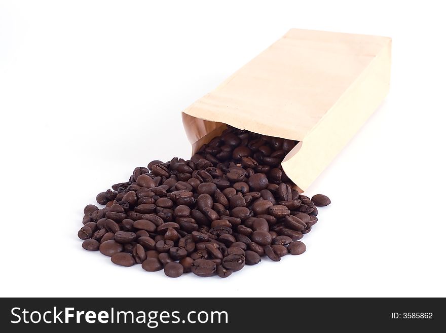 Paper bag with spilled coffee beans. Paper bag with spilled coffee beans