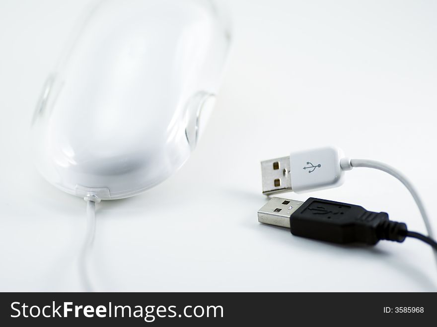 Modern style mouse with two black and white USB plugs. Modern style mouse with two black and white USB plugs