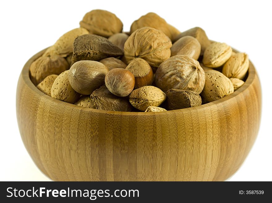 Wooden bowl with variety of nuts. Wooden bowl with variety of nuts