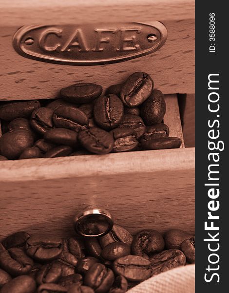 Coffee background: Close-up of a beans, cup, mill. Coffee background: Close-up of a beans, cup, mill