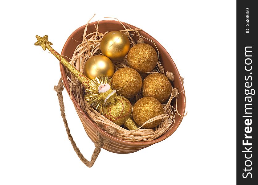 Basket with gold eggs and a New Year's toy. Basket with gold eggs and a New Year's toy