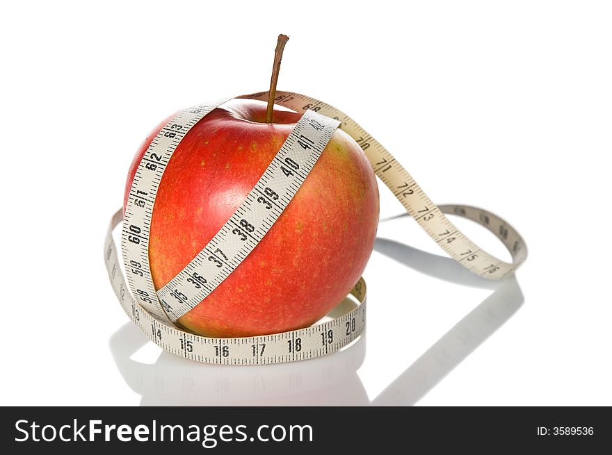 Apple wrapped with tape measure. Apple wrapped with tape measure