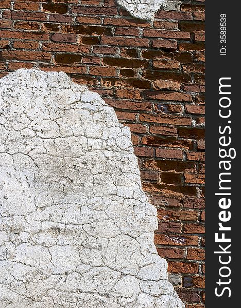 Old wall with the fallen off plaster, the brick is seen. Old wall with the fallen off plaster, the brick is seen