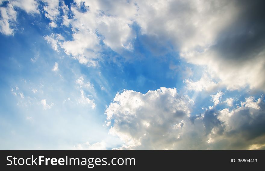 Sky With Clouds And Sun