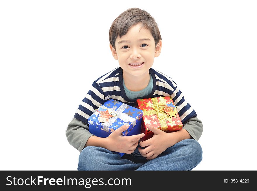 Little boy happy with gift box on white background