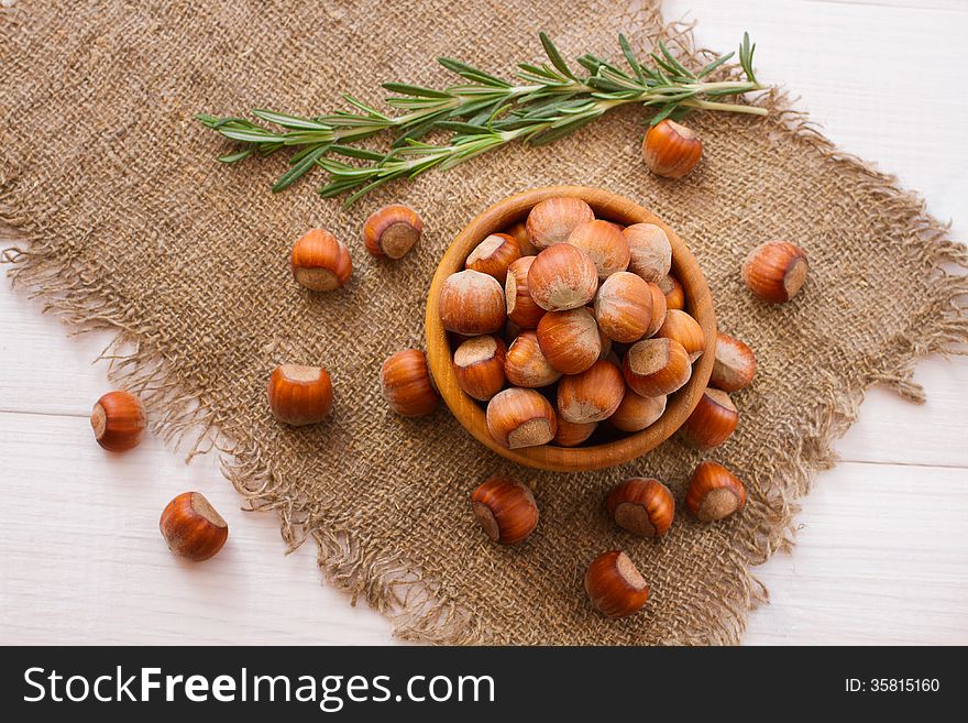 Hazelnuts, filbert on old wooden background closeup