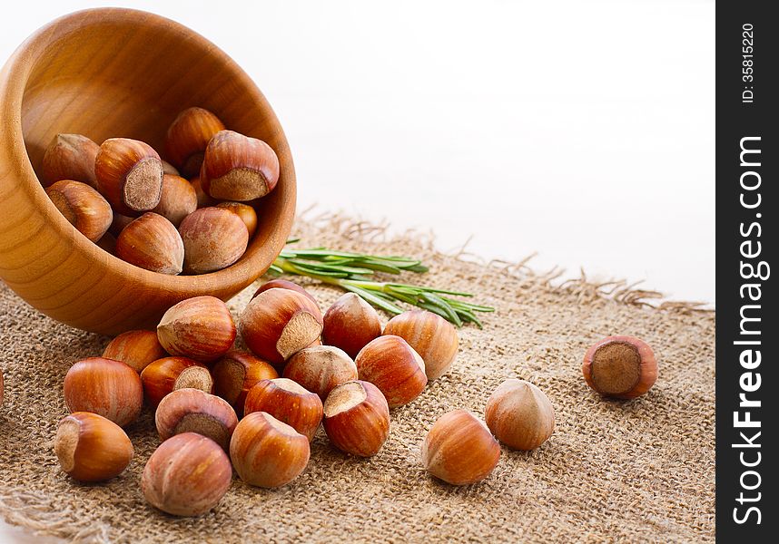 Hazelnuts, filbert on old wooden background closeup