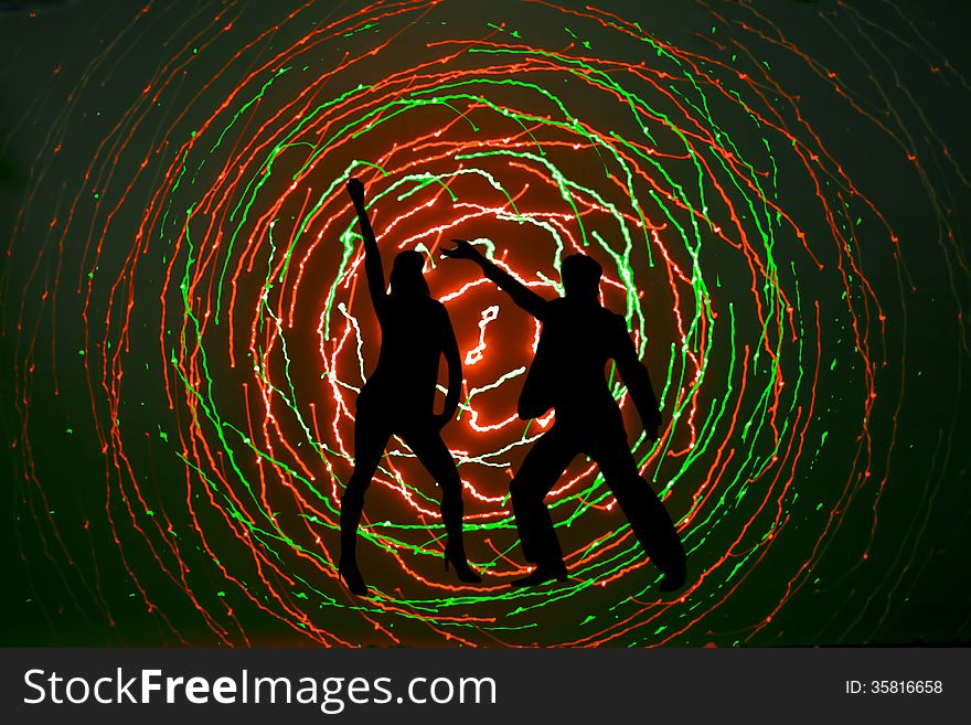 Silhouettes of a disco dancers
