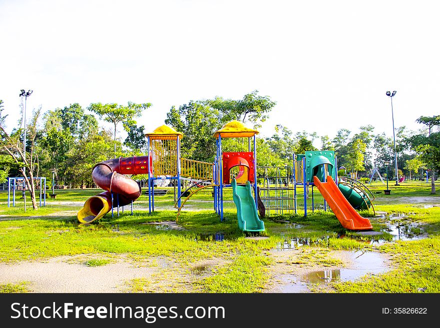 Playground Park On Grass Near School Is Children