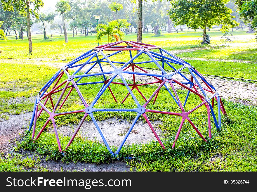 Playground Park On Grass Near School Is Children