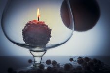Snowball Candle Burning Inside Glass Goblet Stock Image