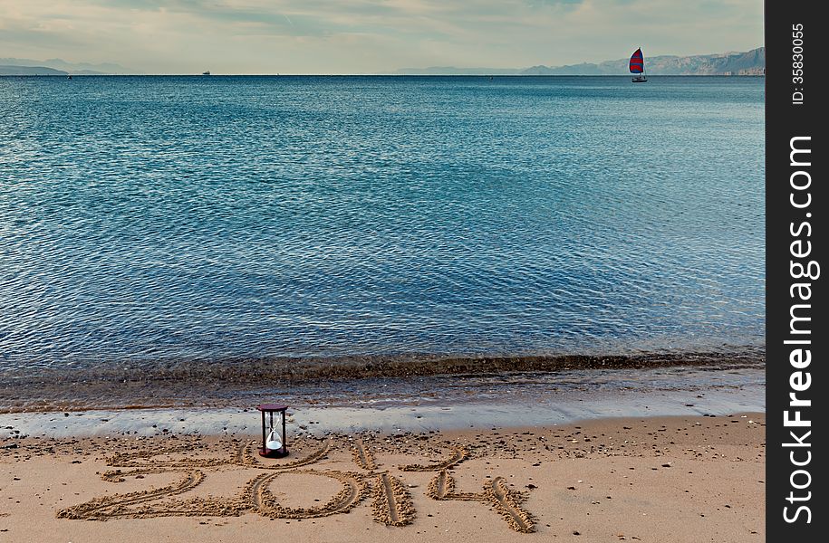 2014 message of New Year on the sand beach near Eilat - famous resort city in Istrael. 2014 message of New Year on the sand beach near Eilat - famous resort city in Istrael