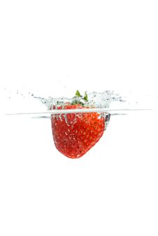 Splashing Strawberry Stock Photography