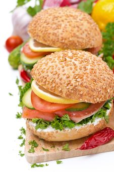 Burger With Smoked Salmon And Vegetables, Isolated Stock Image Burger With Smoked Salmon And Vegetables, Isolated Stock Image