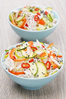 Two Bowls Of Thai Salad With Vegetables, Rice Noodle And Chicken Stock Photos