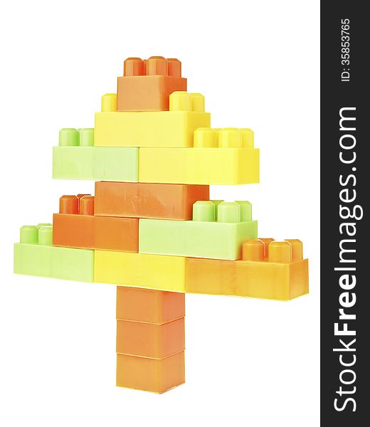 Color brick toy assembly in christmas tree shape on white background. Color brick toy assembly in christmas tree shape on white background