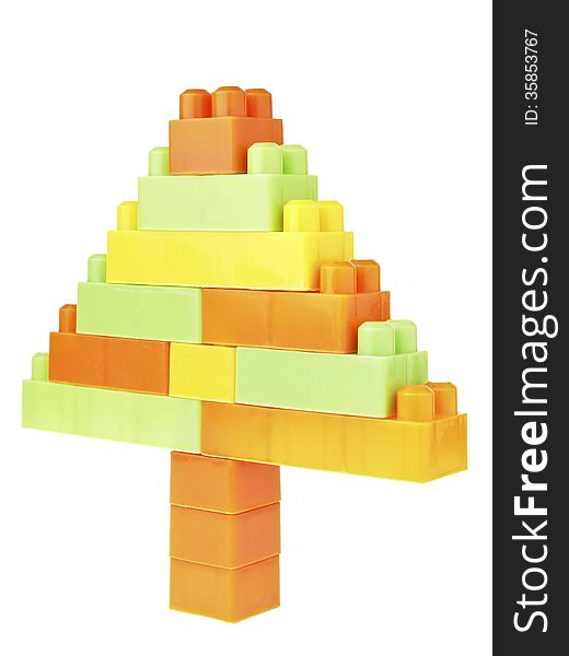 Color brick toy assembly in triangle tree shape on white background. Color brick toy assembly in triangle tree shape on white background