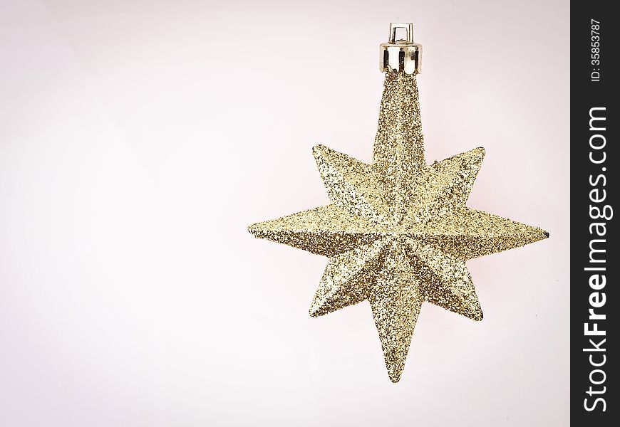 Ornament gold star on white background with vignett conner and copy space. Ornament gold star on white background with vignett conner and copy space