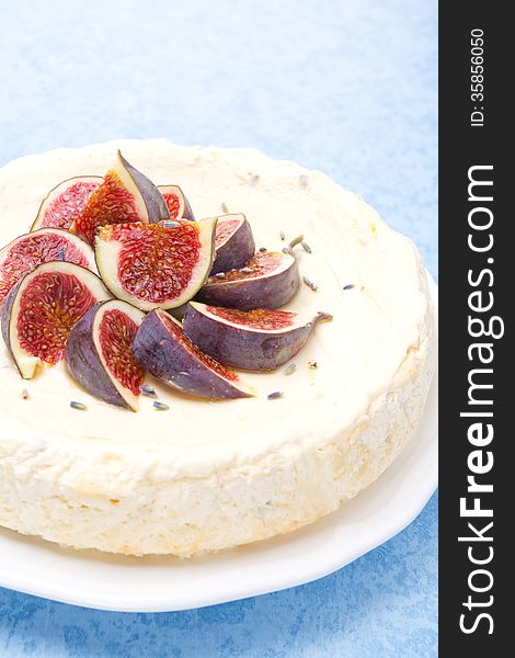 Cheesecake with honey and lavender decorated with fresh figs, vertical close-up. Cheesecake with honey and lavender decorated with fresh figs, vertical close-up