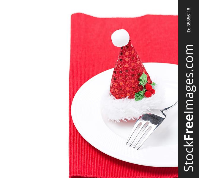 Christmas table setting on a red napkin, isolated