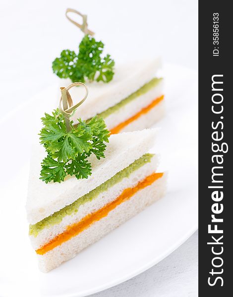 Colorful sandwich with vegetable puree, vertical