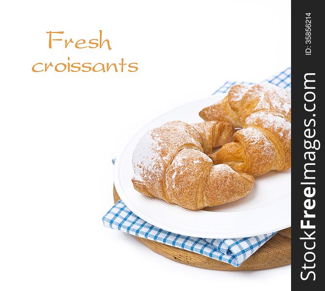 Croissants on a wooden board, isolated